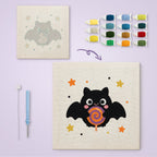 Lollipop Bat canvas before and after punching, with the threads and tools