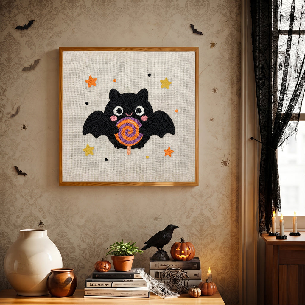Finished Lollipop Bat punch needle canvas on a wall