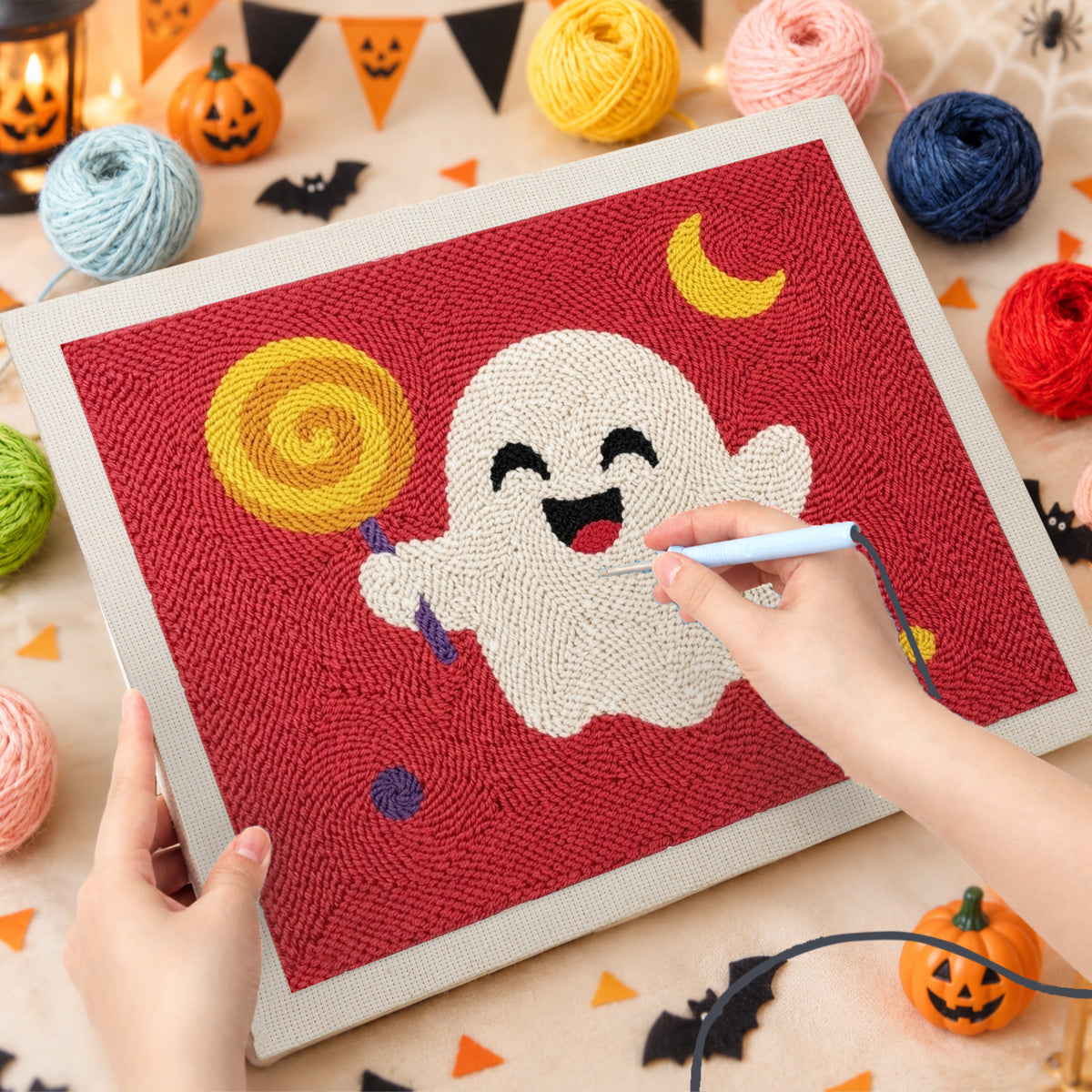 Punching the Lollipop Ghost on Red design with the punch needle