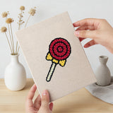 Hand holding a finished Lollipop Lunch mini canvas