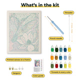 What is in the Lotus Hummingbird kit: printed canvas, punch needle, threader, threads, color guide and hangers