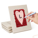 Hand punching one of the Love Letter Hearts mini canvases