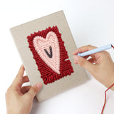 Punching a Love Letter Hearts mini canvas with the punch needle
