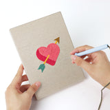 Punching a Love Note Hearts mini canvas with the punch needle