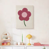 Finished Magenta Bloom punch needle canvas on a wall