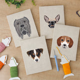 The four finished Mastiff and Beagle mini canvases laid out on a table