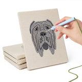 Hand punching one of the Mastiff and Beagle mini canvases