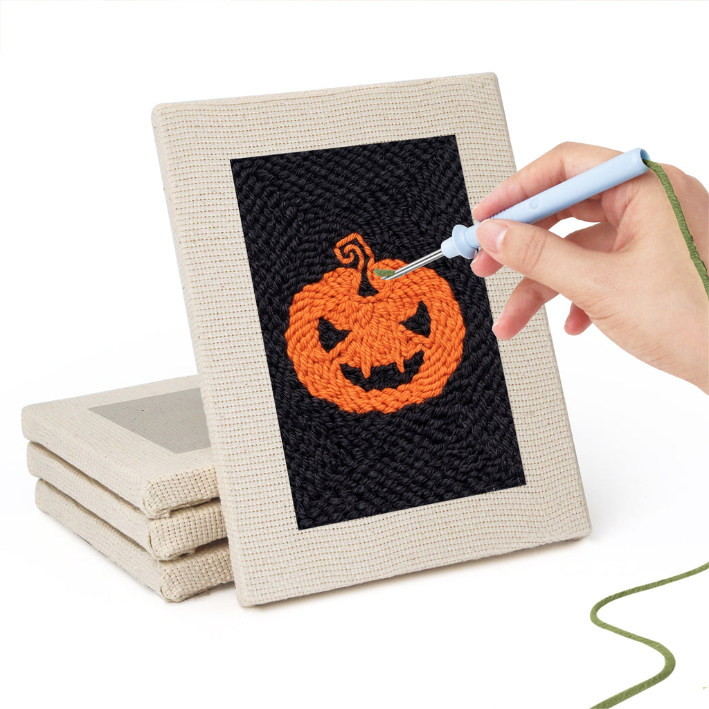 Hand punching one of the Midnight Ghost mini canvases