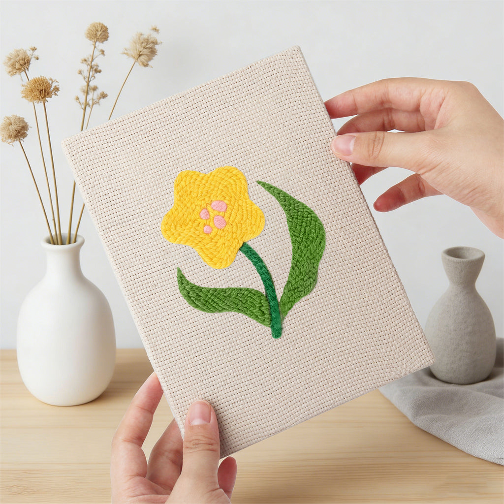 Hand holding a finished Mixed Meadow Blooms mini canvas