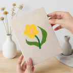 Hand holding a finished Mixed Meadow Blooms mini canvas
