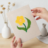 Hand holding a finished Mixed Meadow Blooms mini canvas