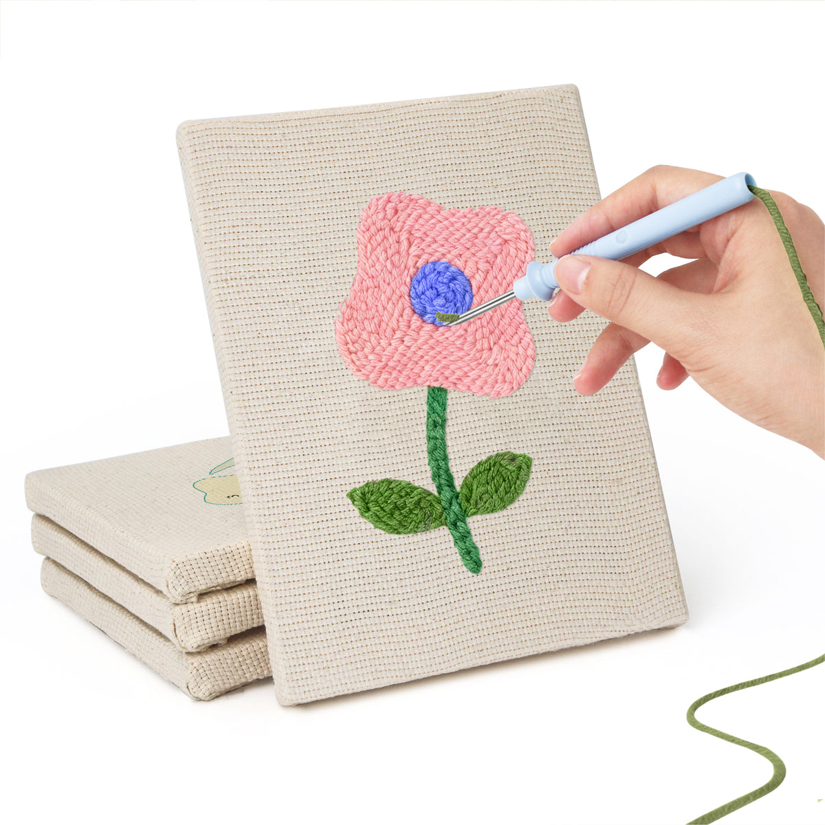 Hand punching one of the Mixed Meadow Blooms mini canvases
