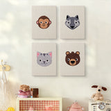 The four Monkey and Wolf mini canvases on a wall above a shelf