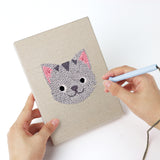 Punching a Monkey and Wolf mini canvas with the punch needle