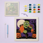 Monster and Cat Nap canvas before and after punching, with the threads and tools