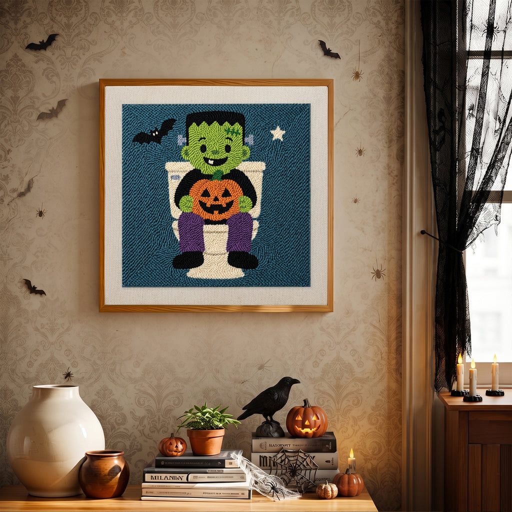 Finished Monster on the Loo punch needle canvas on a wall