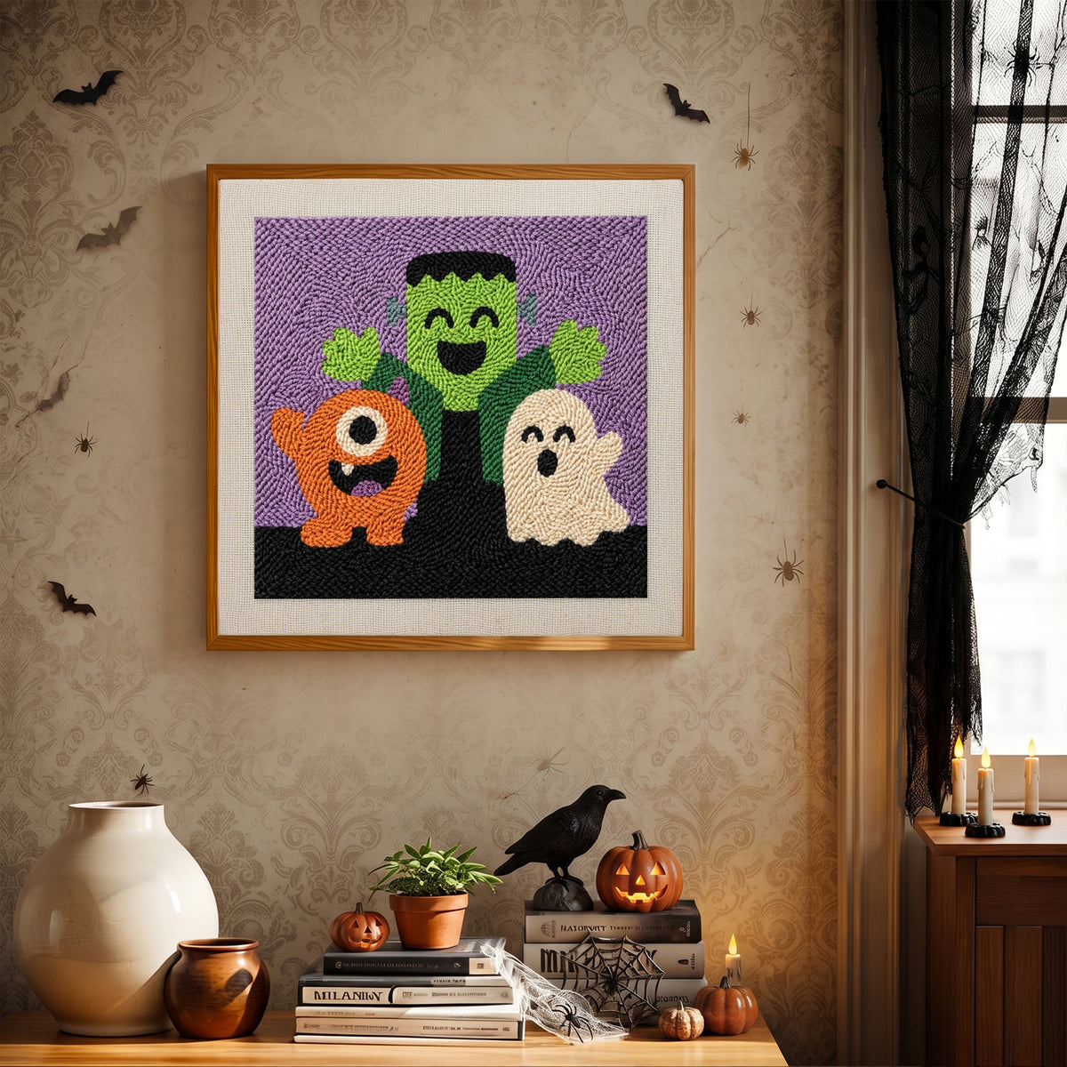 Finished Monster Trio punch needle canvas on a wall