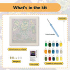 What is in the Monster with Lantern kit: printed canvas, punch needle, threader, threads, color guide and hangers