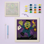 Monster with Lantern canvas before and after punching, with the threads and tools