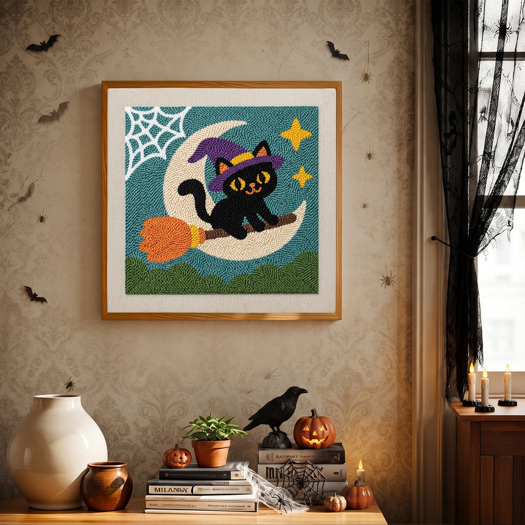 Finished Moon Swing Cat punch needle canvas on a wall