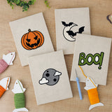 The four finished Moonlit Bats mini canvases laid out on a table