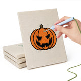 Hand punching one of the Moonlit Bats mini canvases