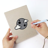 Punching a Moonlit Bats mini canvas with the punch needle