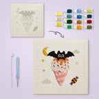 Moonlit Cone Bat canvas before and after punching, with the threads and tools
