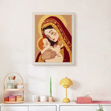Finished Mother and Child punch needle canvas on a wall