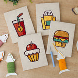 The four finished Movie Night Snacks mini canvases laid out on a table