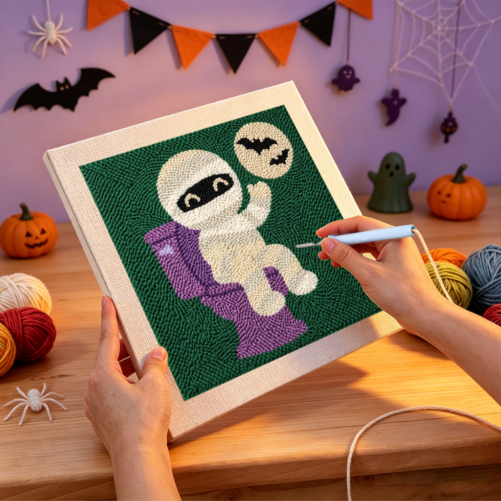 Punching the Mummy on the Loo design with the punch needle