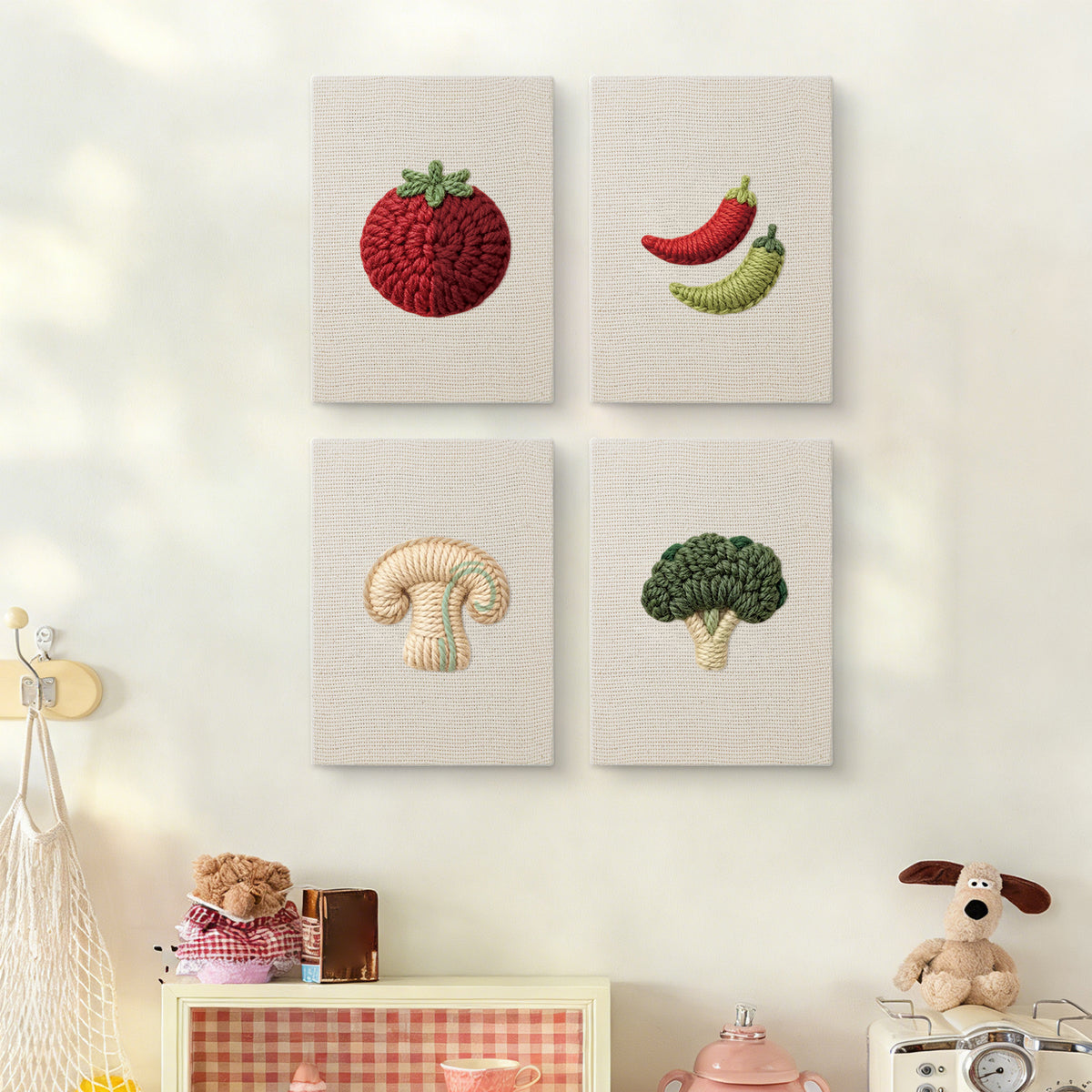 The four Mushroom and Chilies mini canvases on a wall above a shelf