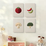The four Mushroom and Chilies mini canvases on a wall above a shelf