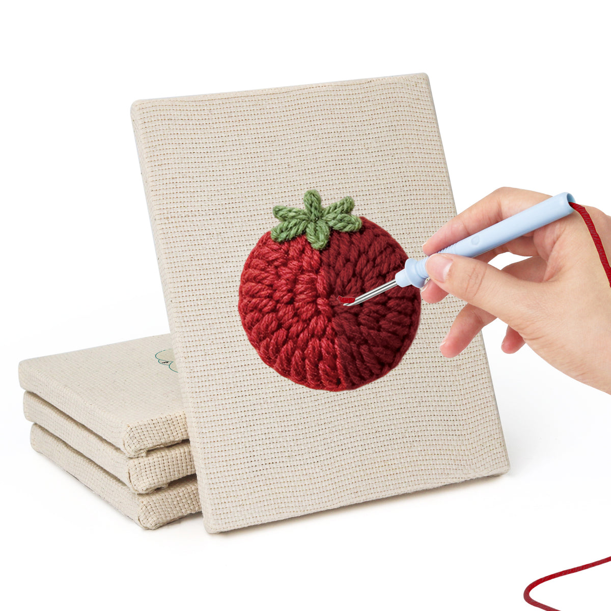 Hand punching one of the Mushroom and Chilies mini canvases