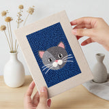 Hand holding a finished Navy Teal Cats mini canvas