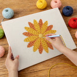 Punching the Orange Dahlia design with the punch needle