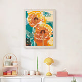 Finished Orange Dandelions punch needle canvas on a wall