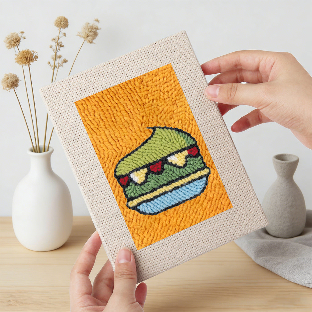 Hand holding a finished Orange Drink Stand mini canvas