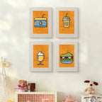 The four Orange Drink Stand mini canvases on a wall above a shelf