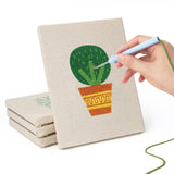 Hand punching one of the Orange Pot Greens mini canvases