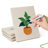 Hand punching one of the Orange Pot Plants mini canvases