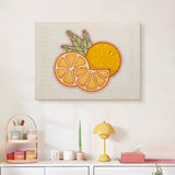 Finished Orange Slices punch needle canvas on a wall