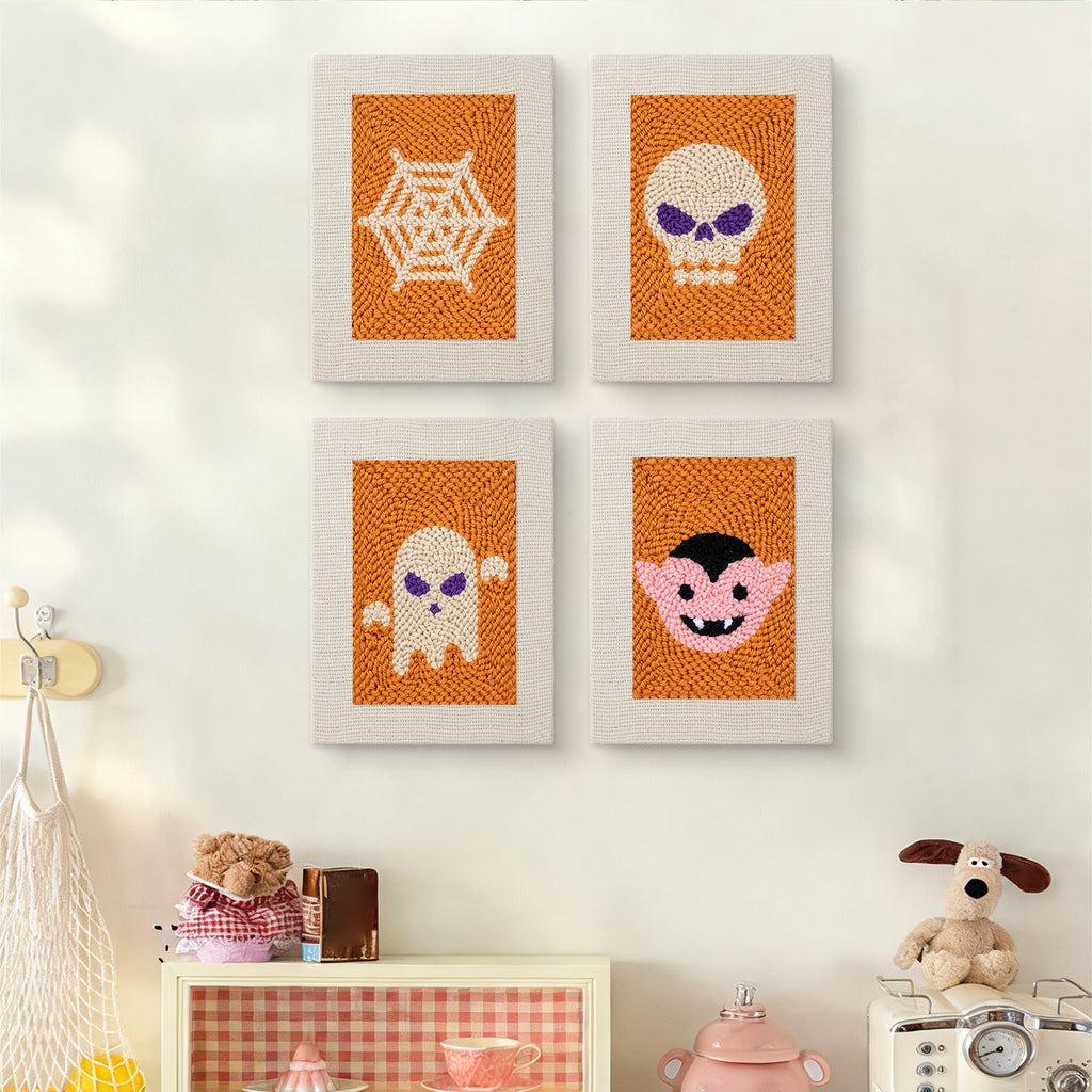 The four Orange Spiderweb mini canvases on a wall above a shelf