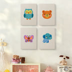 The four Owl and Butterfly mini canvases on a wall above a shelf