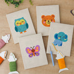 The four finished Owl and Butterfly mini canvases laid out on a table