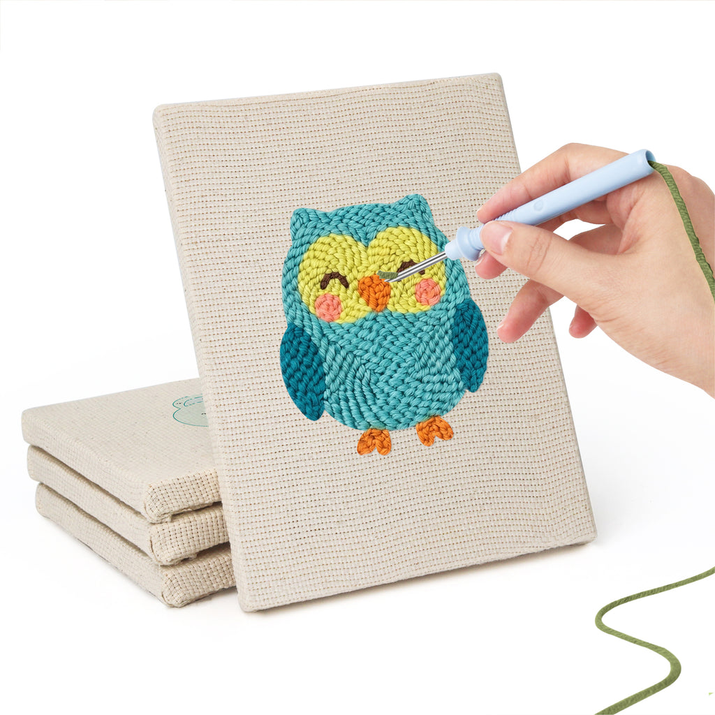 Hand punching one of the Owl and Butterfly mini canvases
