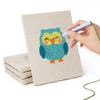 Hand punching one of the Owl and Butterfly mini canvases