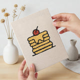 Hand holding a finished Pancake Stacks mini canvas