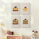 The four Pancake Stacks mini canvases on a wall above a shelf
