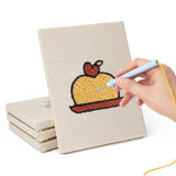 Hand punching one of the Pancake Stacks mini canvases